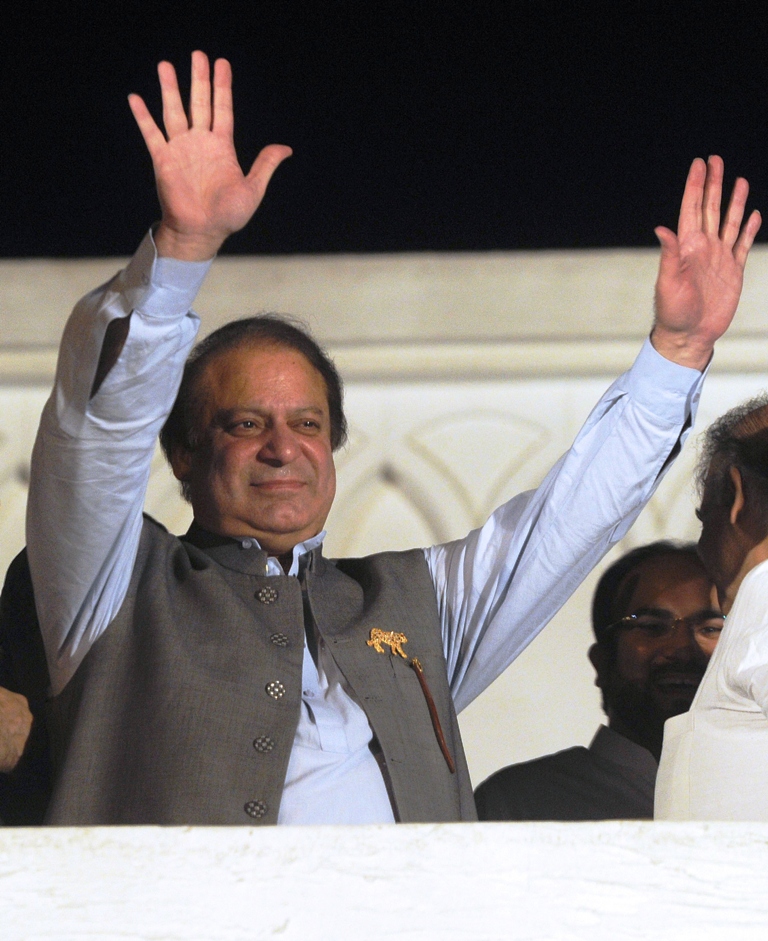 former pakistani prime minister and head of the pakistan muslim league n pml n nawaz sharif waves to supporters in lahore on may 11 2013 photo afp