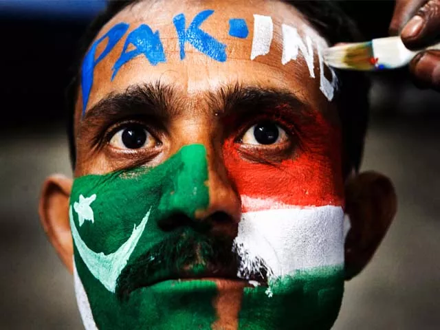 a cricket fan gets his face painted with the colors of the pakistan and indian national flags ahead of the icc world cup semifinal match between india and pakistan in gauhati india tuesday march 29 2011 photo ap a cricket fan gets his face painted with the colors of the pakistan and indian national flags ahead of the icc world cup semifinal match between india and pakistan in gauhati india tuesday march 29 2011 photo ap