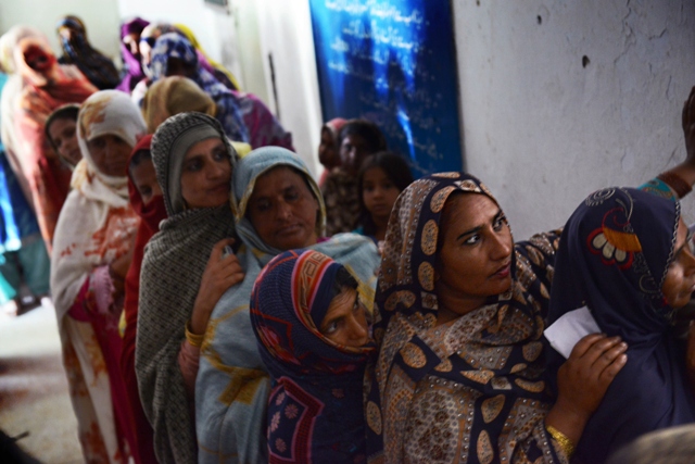 women wanting to vote line up at a polling station photo afp photo