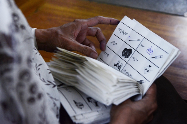 an election official counts votes moments after the voting ended on may 11 2013 photo afp