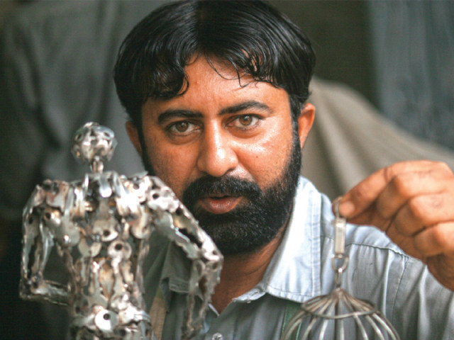 muhammad ismail who has been working at karachi university s visual studies department for 10 years displays one of his iron sculptures photo athar khan express muhammad ismail who has been working at karachi university s visual studies department for 10 years displays one of his iron sculptures photo athar khan express
