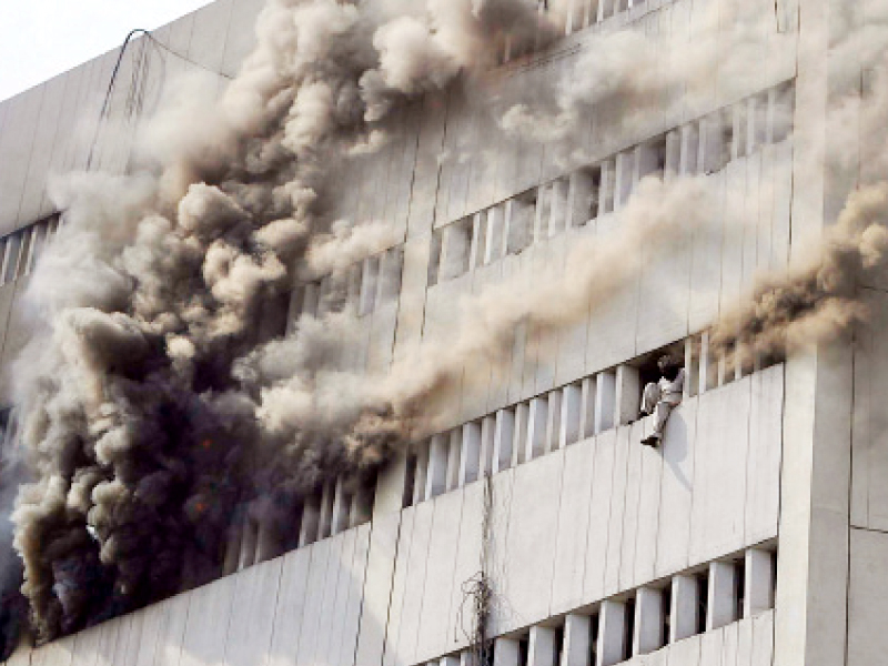 quot when fire fighters entered the building they found used fire extinguishers on the seventh floor quot rescue 1122 pro photo shafiq malik abid nawaz express