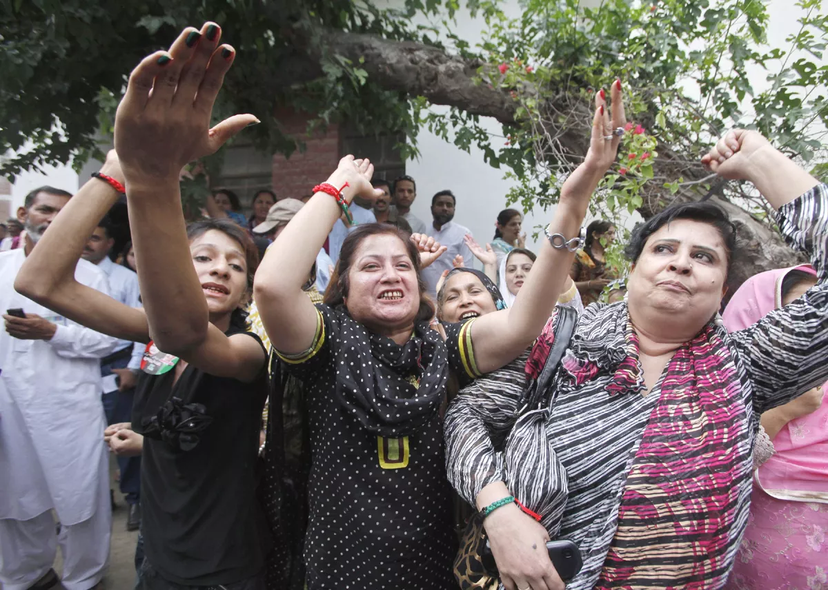 supporters of nawaz sharif not pictured leader of the pakistan muslim league nawaz pml n political party shout slogans upon his arrival to cast his vote for the general election at a polling station in lahore may 11 2013 photo afp supporters of nawaz sharif not pictured leader of the pakistan muslim league nawaz pml n political party shout slogans upon his arrival to cast his vote for the general election at a polling station in lahore may 11 2013 photo afp