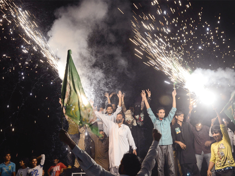 supporters of pakistan muslim league nawaz celebrate with fireworks the victory of their party a day after landmark general elections in lahore photo afp