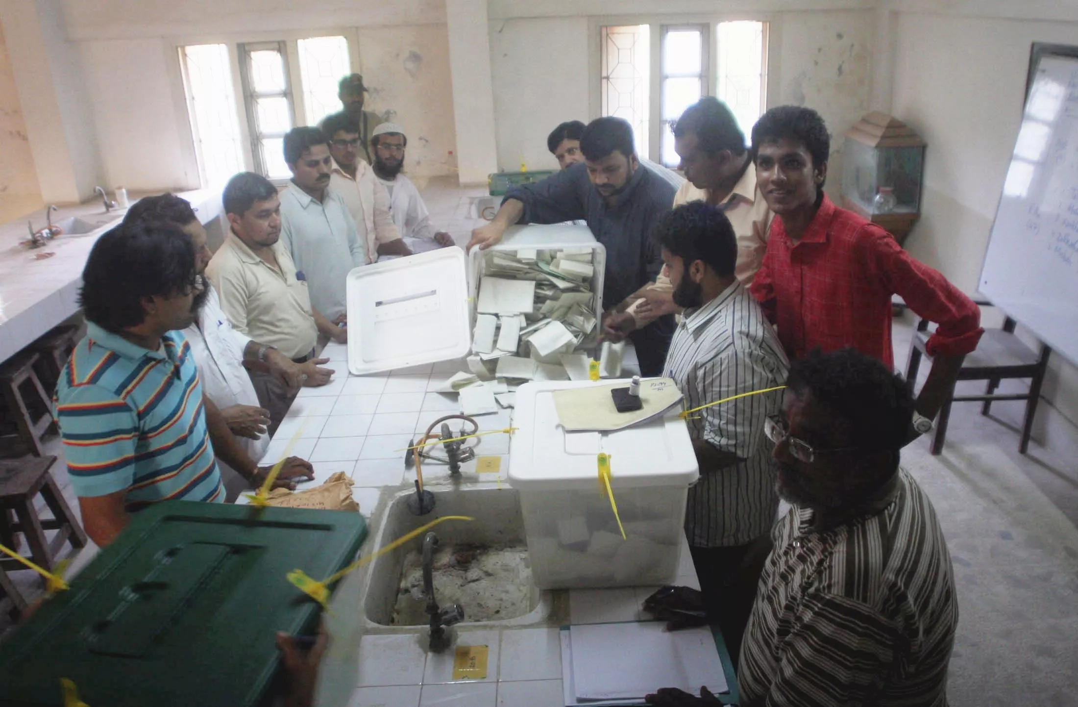 election officials counting votes in abdullah collage after end of the polling time photo athar khan express election officials counting votes in abdullah collage after end of the polling time photo athar khan express