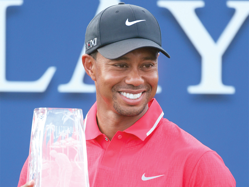 tiger woods claimed his second tpc sawgrass title after securing victory over co leader sergio garcia photo afp