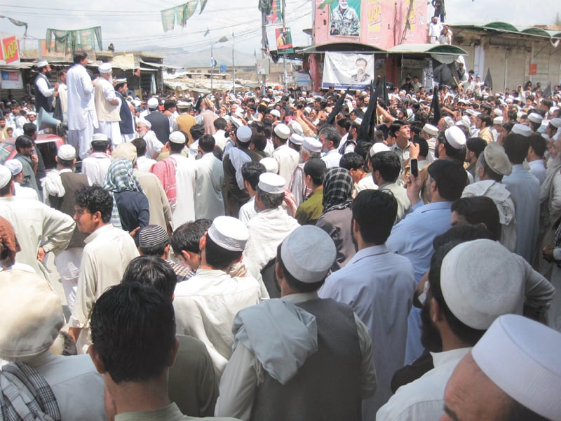 at the protest in khar bazaar ji s sahibzada haroon accused k p governor of influencing polls in his father s favour photo express