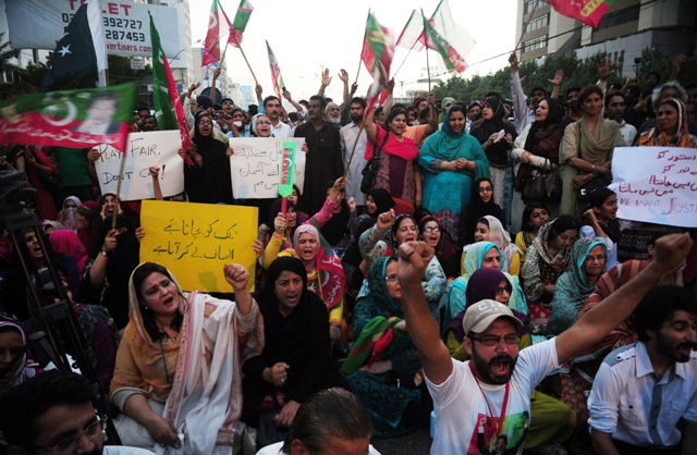 supporters of pakistani politician imran khan shouts slogans during a protest against alleged vote rigging in karachi on may 13 2013 photo afp