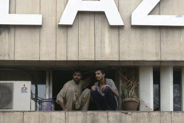 two men wait to be saved from a burning building in central lahore may 9 2013 fire erupted on the seventh floor of the lda plaza in lahore photo reuters two men wait to be saved from a burning building in central lahore may 9 2013 fire erupted on the seventh floor of the lda plaza in lahore photo reuters