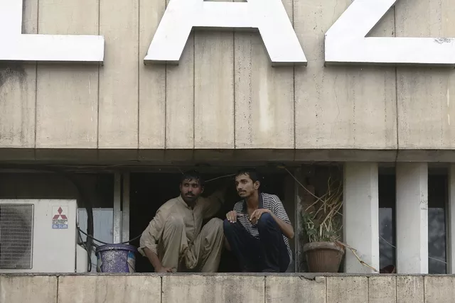 two men wait to be saved from a burning building in central lahore may 9 2013 fire erupted on the seventh floor of the lda plaza in lahore photo reuters two men wait to be saved from a burning building in central lahore may 9 2013 fire erupted on the seventh floor of the lda plaza in lahore photo reuters