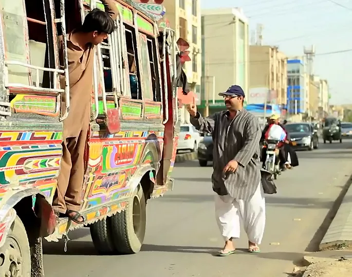 this screenshot shows mumtaz catching a ride on a bus this screenshot shows mumtaz catching a ride on a bus