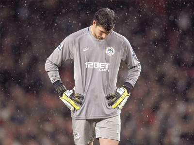 english premier league martinez coy over wigan future