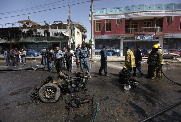 afghan policemen stand guard at the site of a suicide attack in kabul may 16 2013 photo reuters