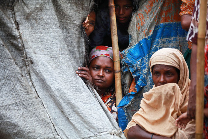 muslim rohingya women sit inside a tent at mansi internally displaced persons idp camp in sittwe photo afp