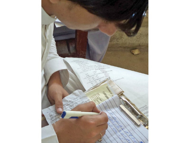 student seen using unfair means to solve his paper during a first year exam in kandhkot photo inp student seen using unfair means to solve his paper during a first year exam in kandhkot photo inp
