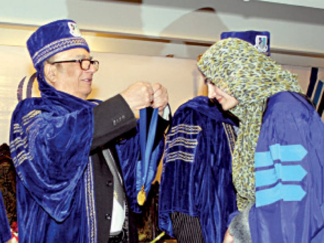 saima bibi receiving her gold medal from former k p governor masood kausar photo file saima bibi receiving her gold medal from former k p governor masood kausar photo file