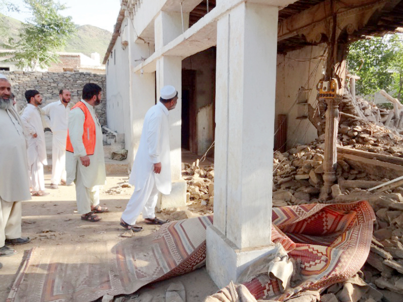 men inspect the mosque damaged by a bomb blast in baz darra area of malakand photo rab nawaz express