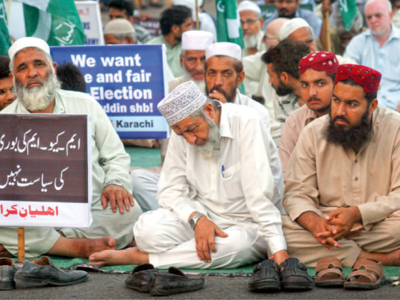 ji leadership gathered to condemn the rigging in the may 11 elections for the seventh consecutive day on saturday the party s leader muhammad hussain mehanti can be seen participating in the peaceful protest photo athar khan express