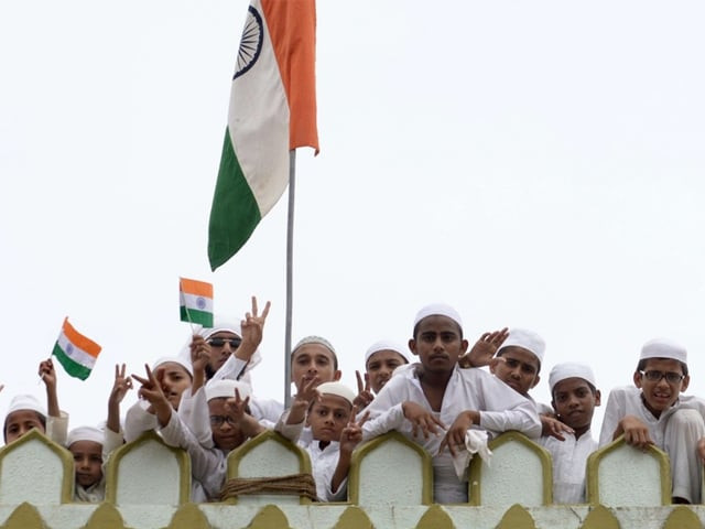 indian muslims celebrate independence day with national flags on the terrace of the madrasa arabia islamia in the juhapura area of ahmedabad on august 15 2015 photo afp indian muslims celebrate independence day with national flags on the terrace of the madrasa arabia islamia in the juhapura area of ahmedabad on august 15 2015 photo afp