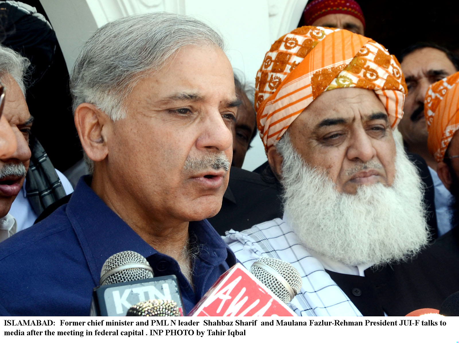 pml n leader shahbaz sharif left and jui f chief maulana fazlur rehman right speak to the media after their meeting in islamabad on thursday photo inp