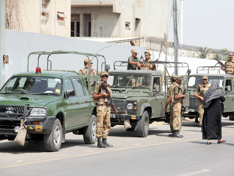 army personnel outside da model school phase iv where re polling took place photo ayesha mir express