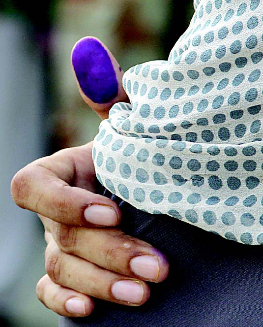 a voter at da model school polling station after casting her vote on sunday photo ayesha mir amp athar khan express