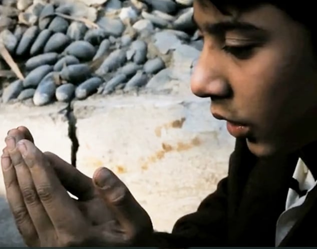 screengrab of samiulla praying