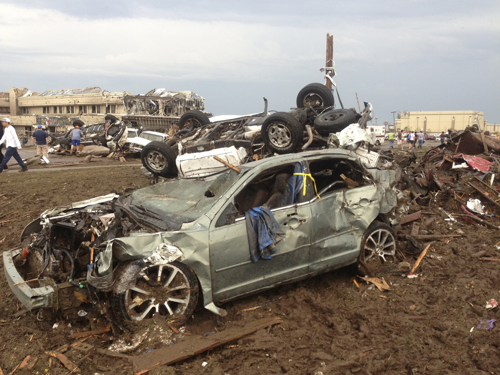 overturned cars are seen from destruction from a huge tornado near oklahoma city oklahoma photo reuters