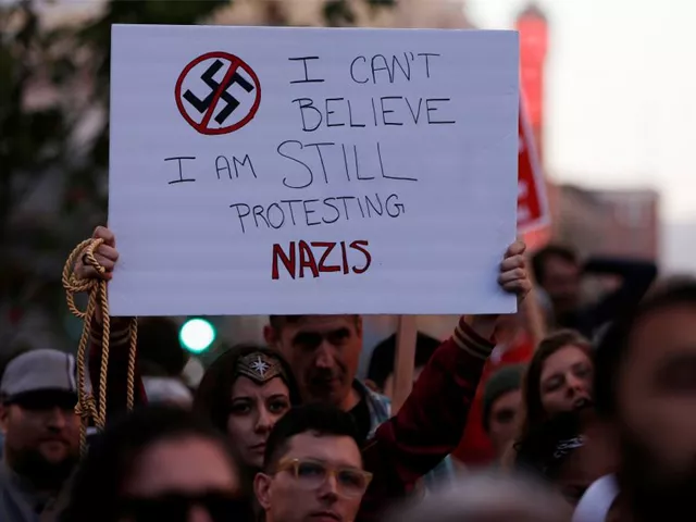 a demonstrator holds signs during a rally in response to the charlottesville virginia car attack on counter protesters after the quot unite the right quot rally organized by white nationalists in oakland california u s august 12 2017 photo reuters a demonstrator holds signs during a rally in response to the charlottesville virginia car attack on counter protesters after the quot unite the right quot rally organized by white nationalists in oakland california u s august 12 2017 photo reuters