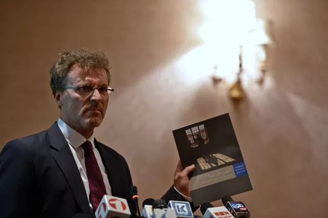 deputy director of asia human rights watch phelim kine holds a copy of the dari language human rights watch magazine as he addresses a press conference on women and 039 moral crimes 039 in kabul on may 21 2013 photo afp deputy director of asia human rights watch phelim kine holds a copy of the dari language human rights watch magazine as he addresses a press conference on women and 039 moral crimes 039 in kabul on may 21 2013 photo afp
