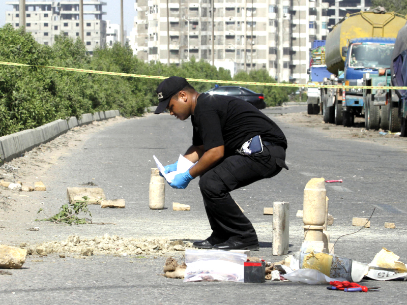 an explosives expert defuses the bomb near clifton photo athar khan express