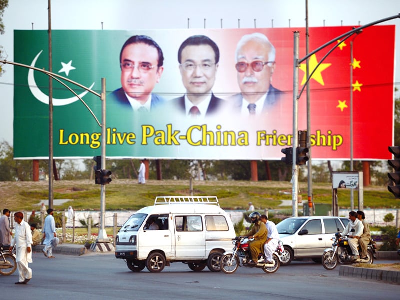 a welcome billboard shows portraits of president zardari chinese premier li keqiang and caretaker pm khoso in islamabad photo afp