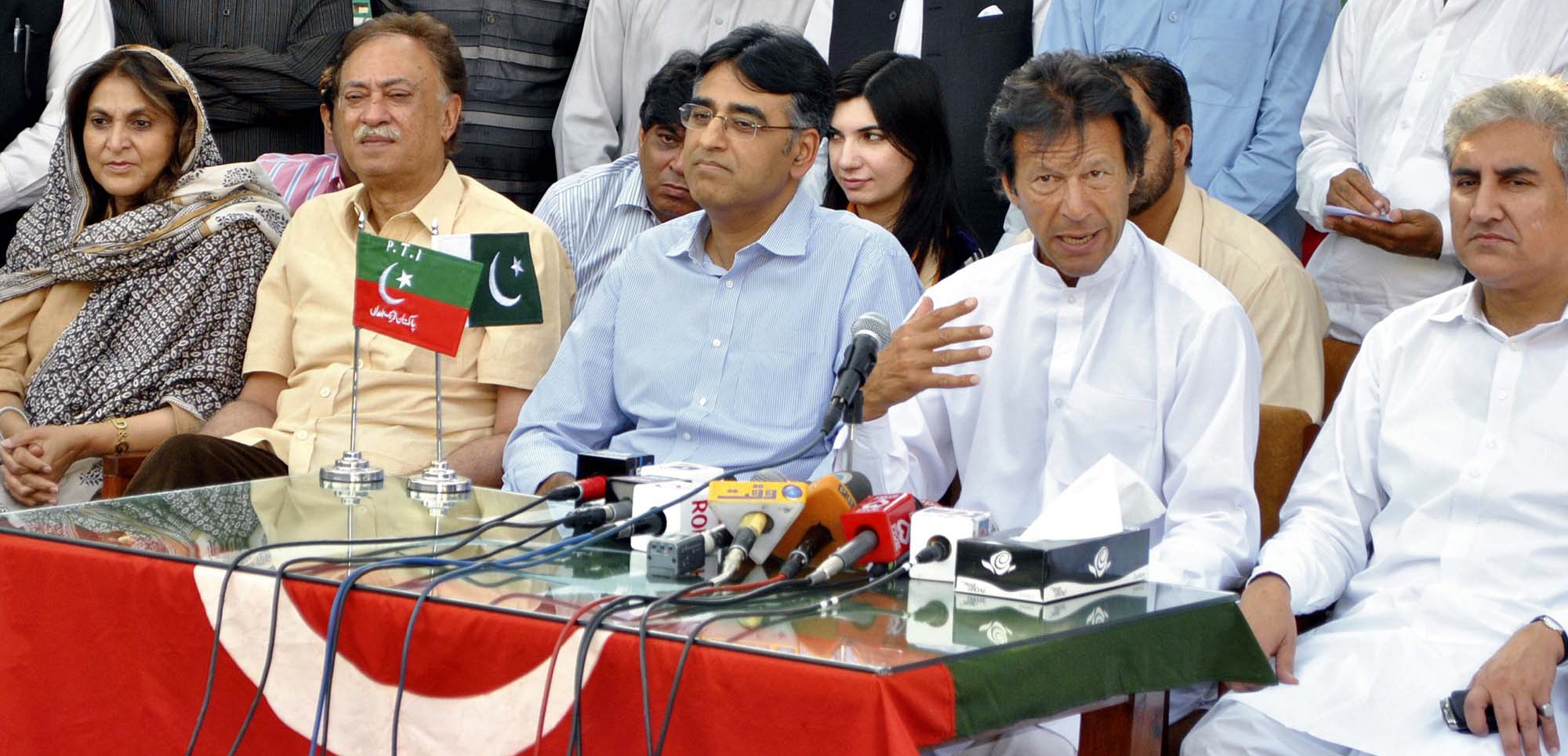 former engro ceo asad umar with pti chief imran khan at a press conference at pti secretariat in islamabad photo sana