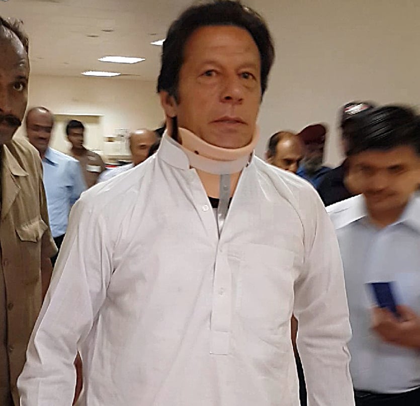 this handout photograph released by the shaukat khanum memorial hospital shows imran khan leaving the hospital in lahore on may 22 2013 photo afp