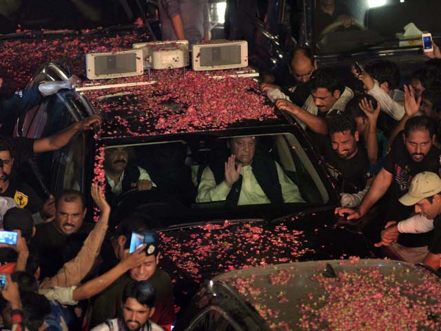 pakistani ousted prime minister nawaz sharif c waves as his convoy passes supporters during a rally on august 12 2017 in lahore photo afp