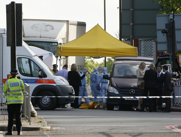 police forensics officers investigate a crime scene where one man was killed in woolwich southeast london may 22 2013 photo afp