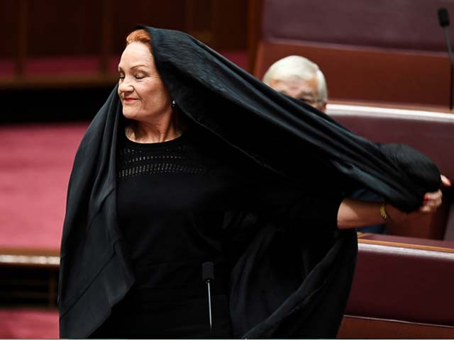 australian one nation party leader senator pauline hanson pulls off a burka at parliament house yesterday photo reuters australian one nation party leader senator pauline hanson pulls off a burka at parliament house yesterday photo reuters