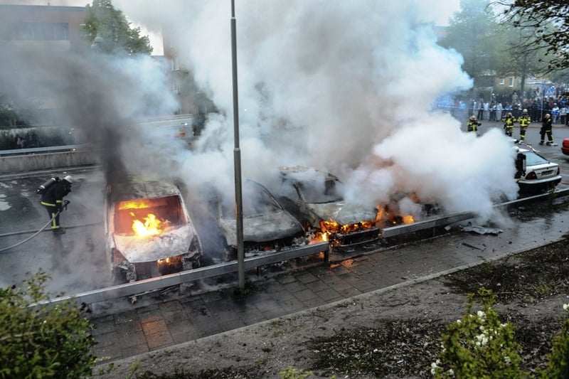 firemen extinguish a row of burning cars in the suburb of rinkeby after youths rioted in several different suburbs around stockholm may 23 2013 photo reuters