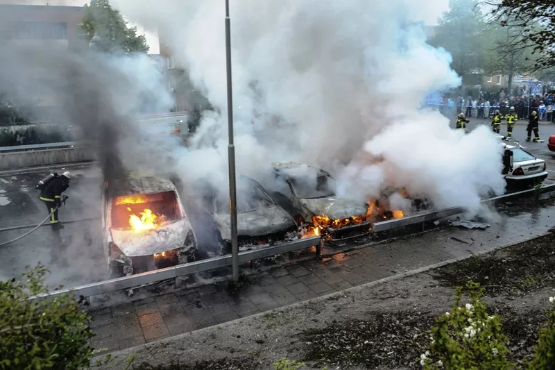 firemen extinguish a row of burning cars in the suburb of rinkeby after youths rioted in several different suburbs around stockholm may 23 2013 photo reuters firemen extinguish a row of burning cars in the suburb of rinkeby after youths rioted in several different suburbs around stockholm may 23 2013 photo reuters