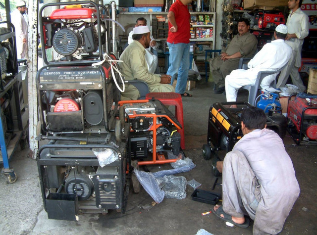 a mechanic busy in repairing power generators at his shop as demands for power generators has increased due to loadshedding photo inp