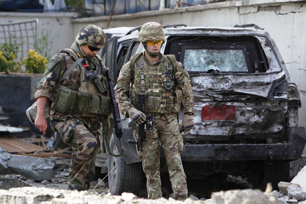 foreigners troops part of the nato led international security assistance force isaf investigate at the site of an incident in kabul may 25 2013 photo reuters