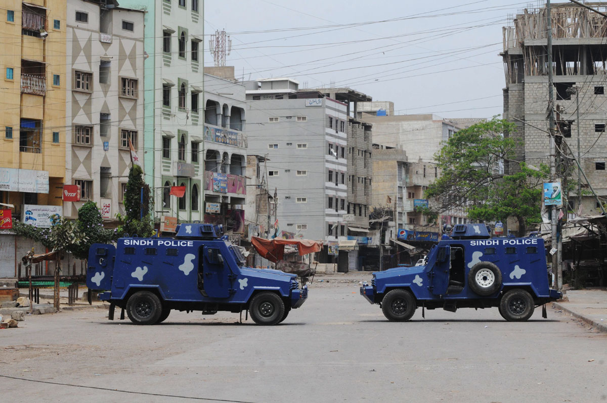 a file photo shows armoured personnel carriers of the police standing guard in lyari photo express file