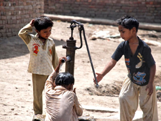 a boy helps his friend bathe in the water from a hand pump as the mercury continues to rise in upper sindh yet power outages worsen photo naeem ghouri express a boy helps his friend bathe in the water from a hand pump as the mercury continues to rise in upper sindh yet power outages worsen photo naeem ghouri express
