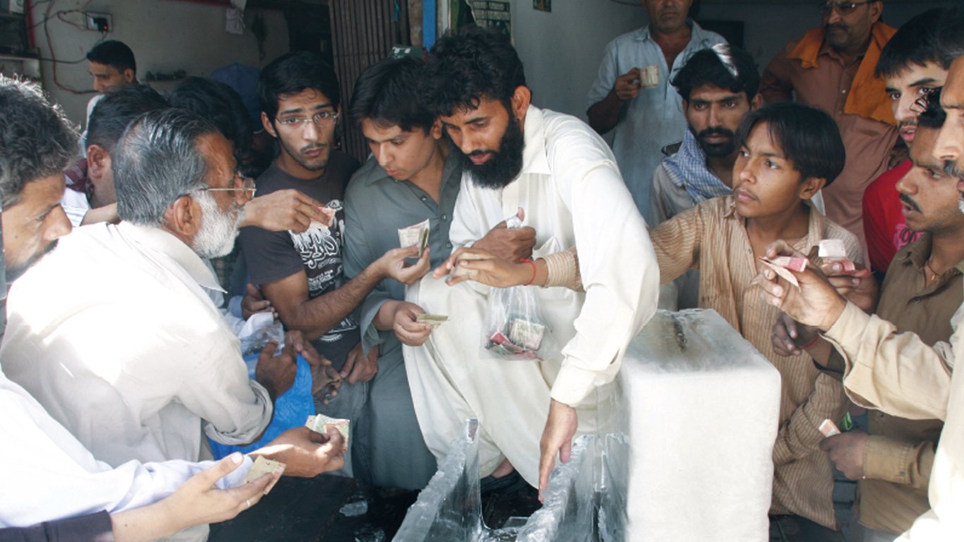 loadshedding and heat take their toll buyers scramble over each other trying to purchase blocks of ice at krishan nagar photo abid nawaz express