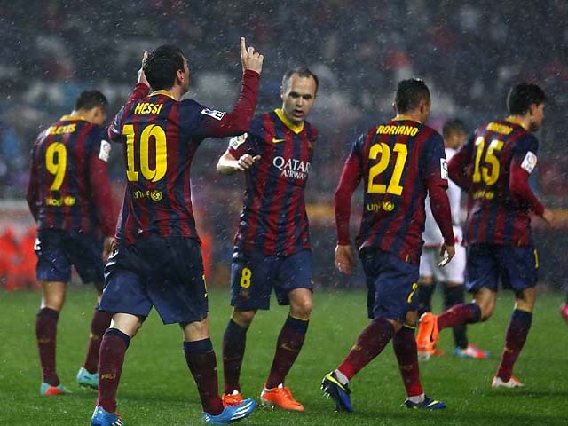 barcelona s lionel messi is congratulated by team meates after scoring against sevilla photo reuters