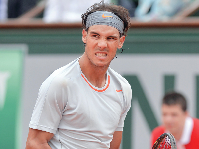 spanish third seed nadal looking to win the claycourt grand slam for a record extending eighth time survived a scare against brands to ease into round two photo afp