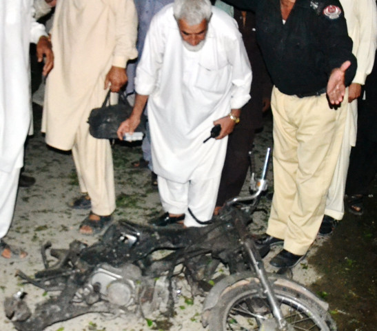 bomb disposal officials inspect the motorcycle used in the bombing photo sameer raziq bomb disposal officials inspect the motorcycle used in the bombing photo sameer raziq