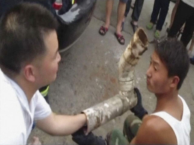 rescuers try to reach a trapped infant inside a piece of sewage pipe photo reuters rescuers try to reach a trapped infant inside a piece of sewage pipe photo reuters