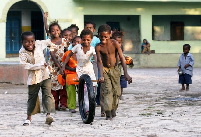 in this file photograph taken on december 10 2007 sidi tribal children play outside their homes in the village of jambur some 480kms south west of ahmedabad photo afp