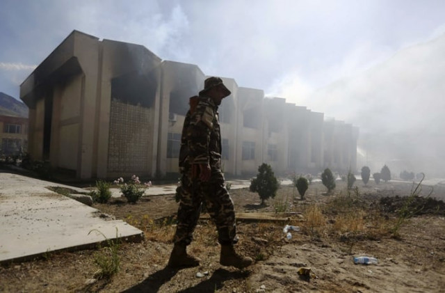 an afghan security officer walks in front of a panjshir government building after an attack by insurgents in panjshir province may 29 2013 photo reuters an afghan security officer walks in front of a panjshir government building after an attack by insurgents in panjshir province may 29 2013 photo reuters